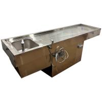 Аутопсійний стіл на тумбі з сантехнікою